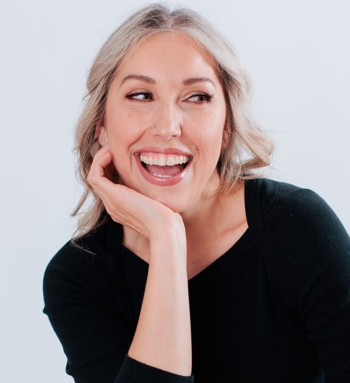 White blonde professional woman in black White blonde professional woman wearing black against white background